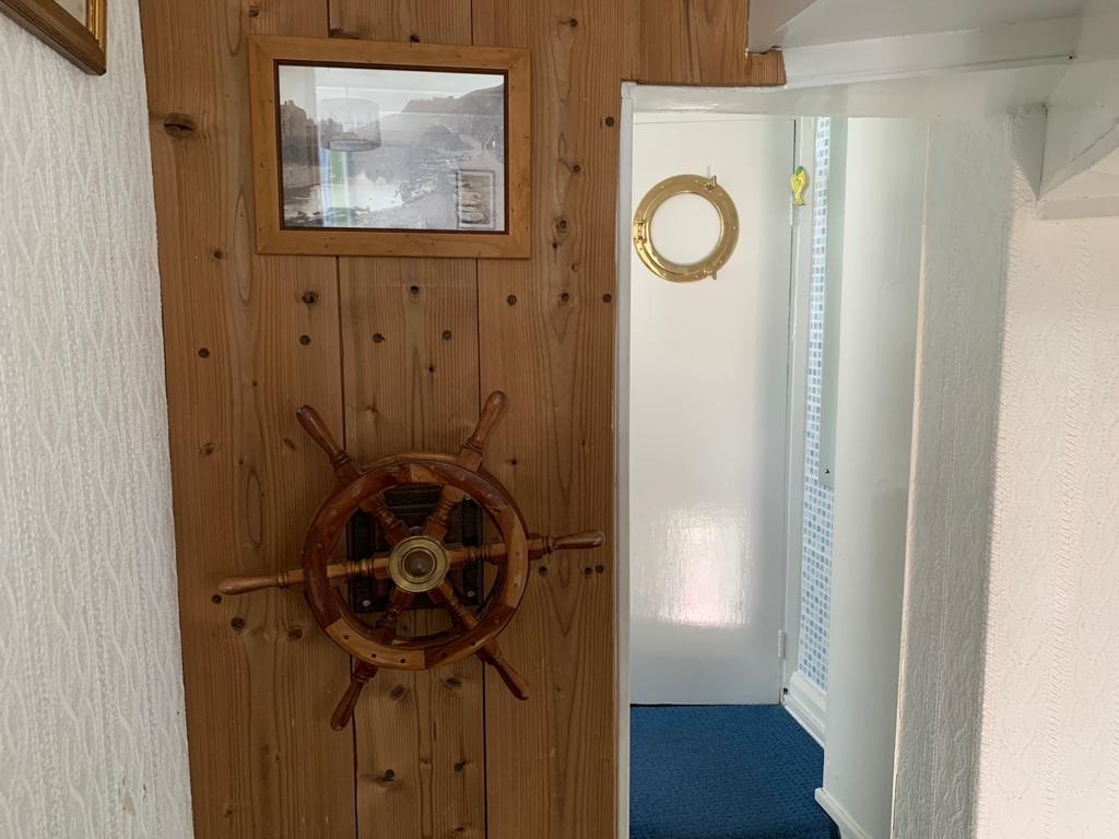 Ships wheel at Sea Haven Cottage, Staithes